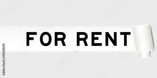 Ripped gray paper background that have word for rent under torn part