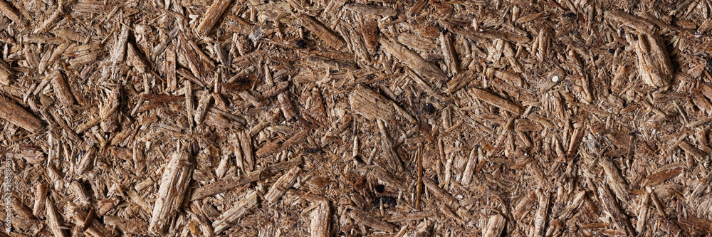 Chipboard texture. Rough particle board surface. Particleboard background. Wood building material. Close-up. Chipboard texture. Rough particle board surface. Particleboard background. Wood building material. Close-up.