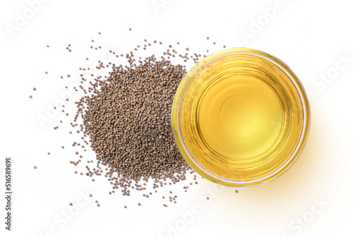 Perilla flutescens seeds and perilla seed oil in glass bowl isolated on white background, top view, flat lay.