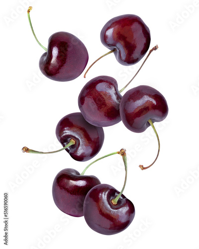 Tablou pe pânză Fresh red cherry flying in the air isolated on white background.