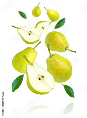 Green pear with leaves flying in the air isolated on white background.