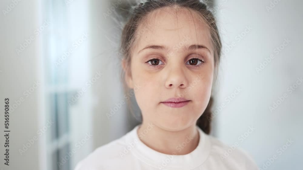 serious little girl portrait. happy family a problems kid dream concept. sad frowning lifestyle little girl close-up indoors. depression unhappy child. lonely frightened daughter portrait serious little girl portrait. happy family a problems kid dream concept. sad frowning lifestyle little girl close-up indoors. depression unhappy child. lonely frightened daughter portrait