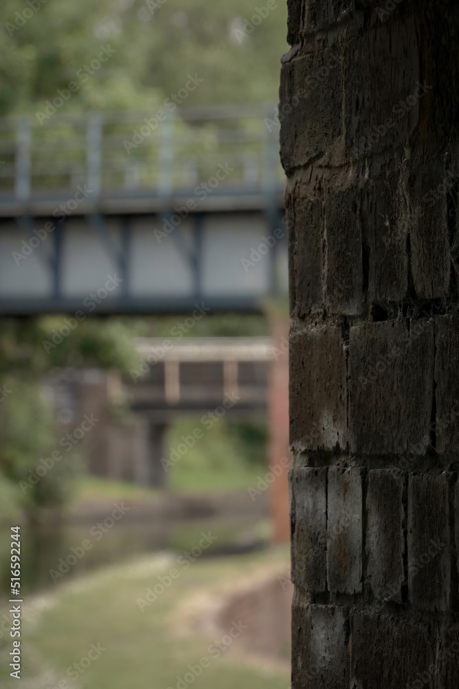 Abstract shallow focus shot of old brickwork and a distant canal bridge Abstract shallow focus shot of old brickwork and a distant canal bridge