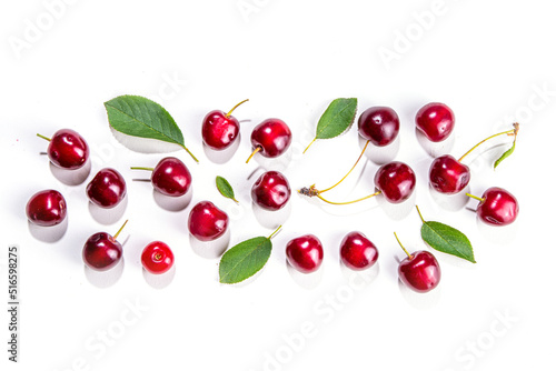 Fresh ripe raw cherry berry with leaf isolated on white background