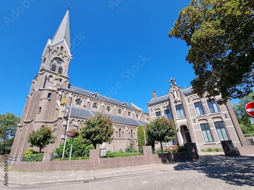 The Neo-Romanesque Catholic Ursula Church and historic building in Warmenhuizen, North Holland, Holland, The Netherlands