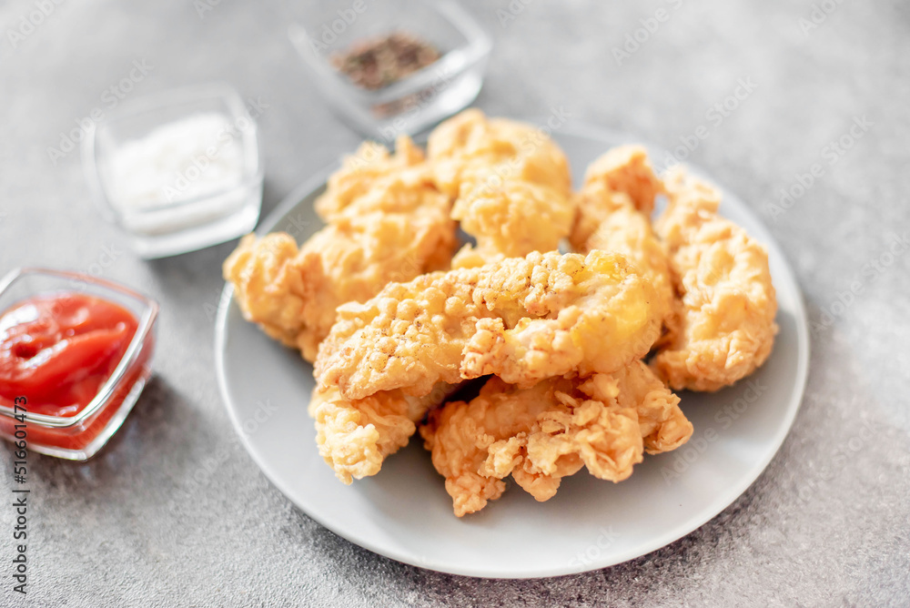 Chicken strips on stone background Chicken strips on stone background
