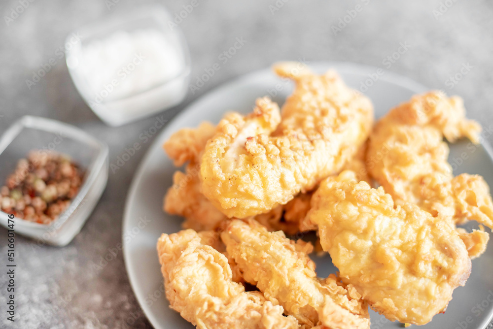 Chicken strips on stone background Chicken strips on stone background