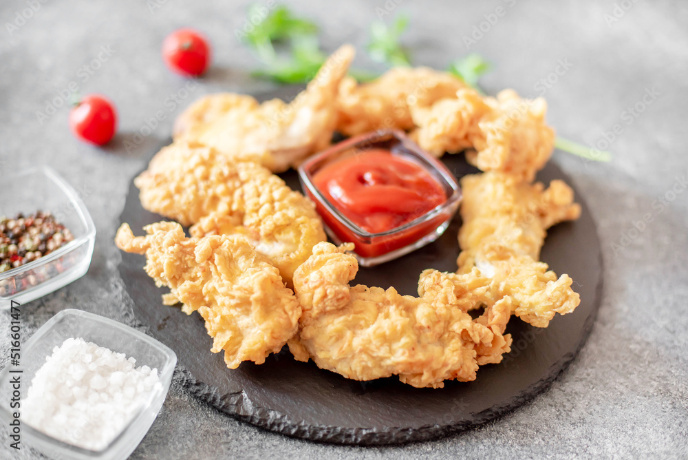 Chicken strips on stone background Chicken strips on stone background