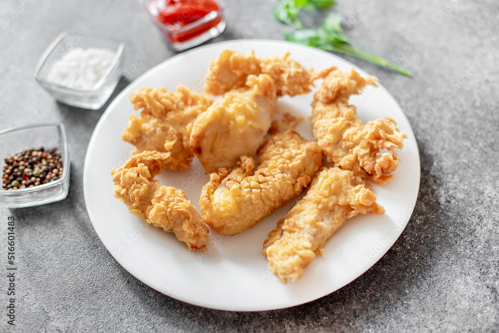 Chicken strips on stone background Chicken strips on stone background