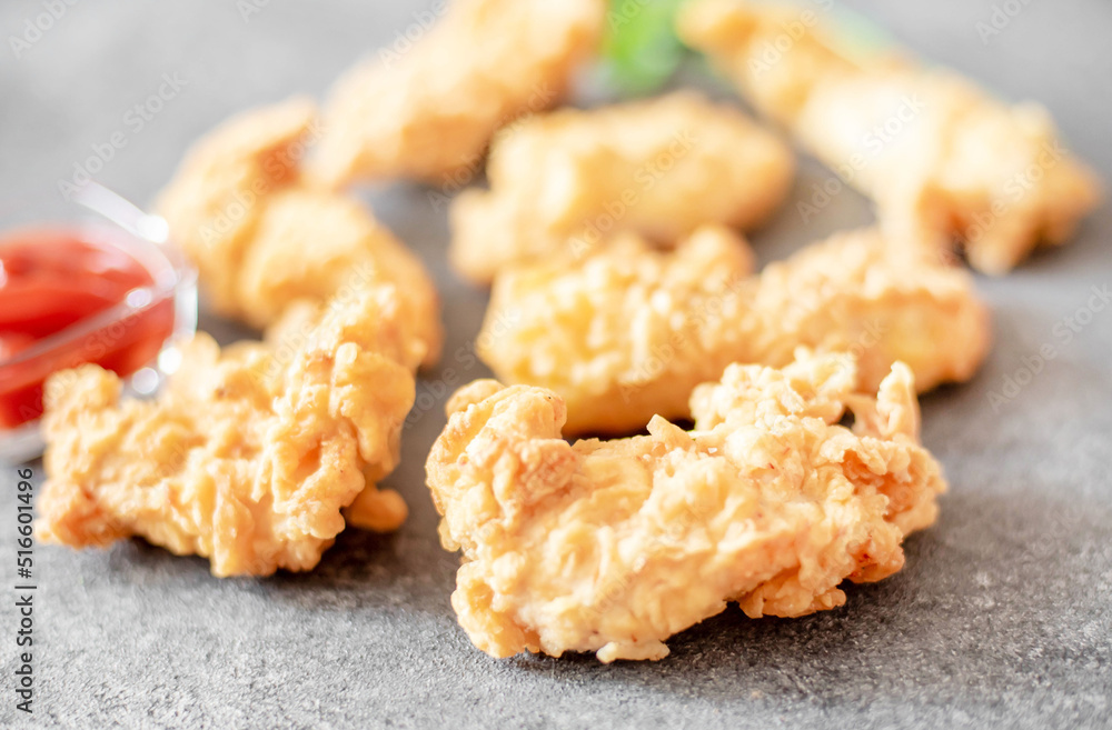 Chicken strips on stone background Chicken strips on stone background