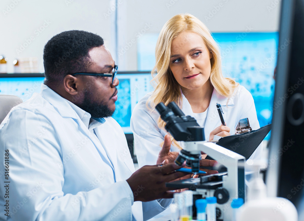 Professional Doctors Doing Monkeypox Research in a Modern Futuristic Laboratory. Lab Experiments in Clinic Hospital. Science and Medicine Concept. Professional Doctors Doing Monkeypox Research in a Modern Futuristic Laboratory. Lab Experiments in Clinic Hospital. Science and Medicine Concept.