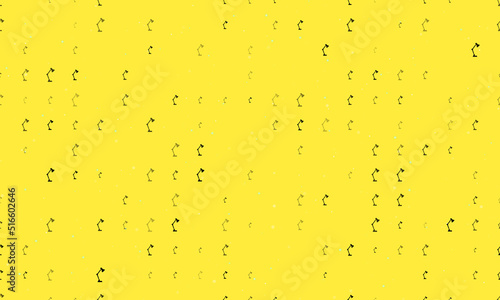 Seamless background pattern of evenly spaced black table lamp symbols of different sizes and opacity. Vector illustration on yellow background with stars