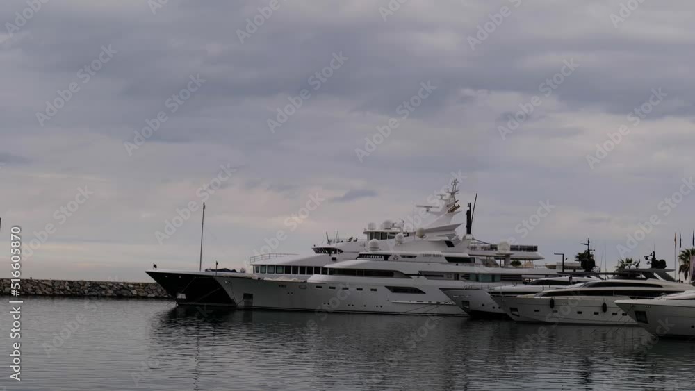 the port of Puerto Banus in Marbella Spain with the large yachts moored side by side the port of Puerto Banus in Marbella Spain with the large yachts moored side by side