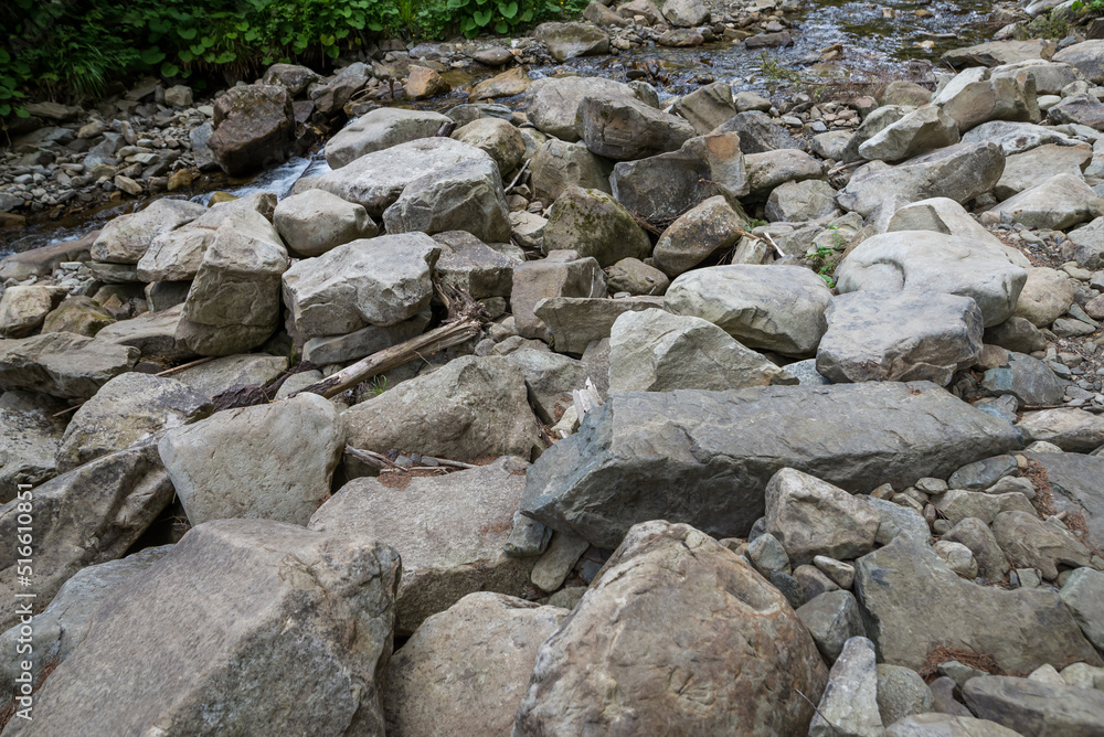 Mountain road in the Carpathians with large stones. Stone route to the mountains. Close-up of stones. Difficult path to the top of the mountain.