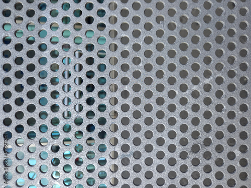 288 / 5.000Resultados de traducciónMetal panel background with holes. Perforated aluminum sheet metal. Full frame perforated steel. photo