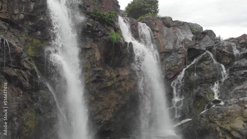 Slide up waterfall in the forest - Drone shot Slide up waterfall in the forest - Drone shot