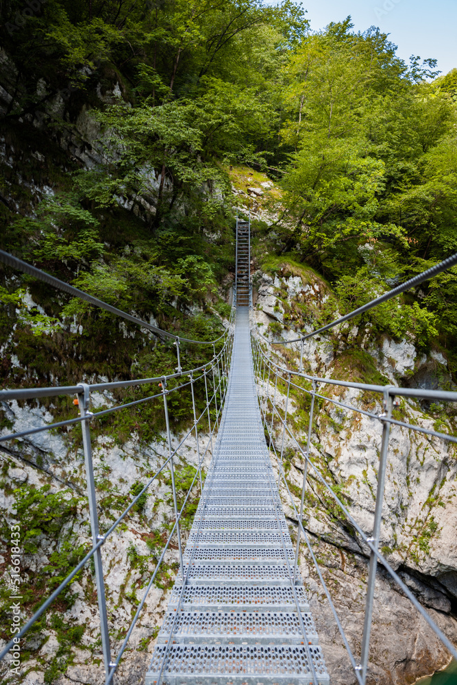 First person view of a suspended bridge in Barcis, Italy.