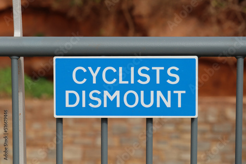 Road sign on the new Alma Bridge telling cyclists to dismount and walk across the bridge. Done in the name of safety