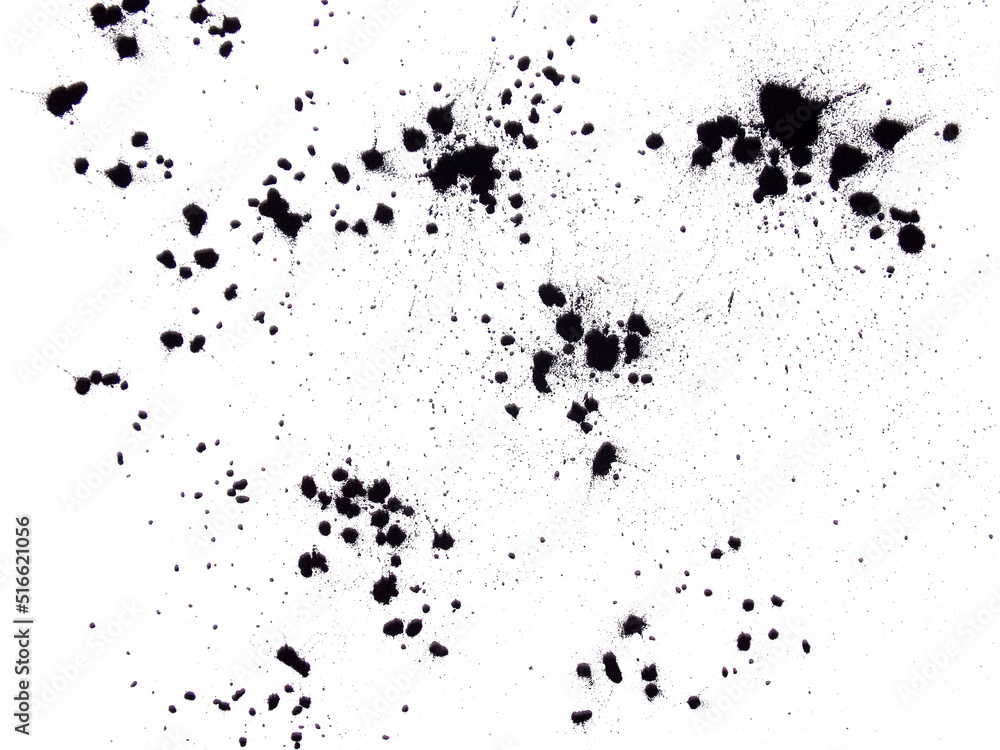 Black ink spots on a white background.