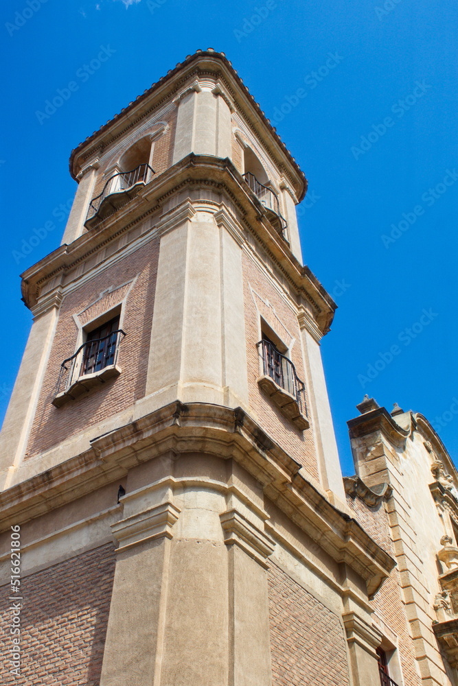 Beautiful high tower with bell tower in the baroque church of Santa Eulalia in Murcia Beautiful high tower with bell tower in the baroque church of Santa Eulalia in Murcia