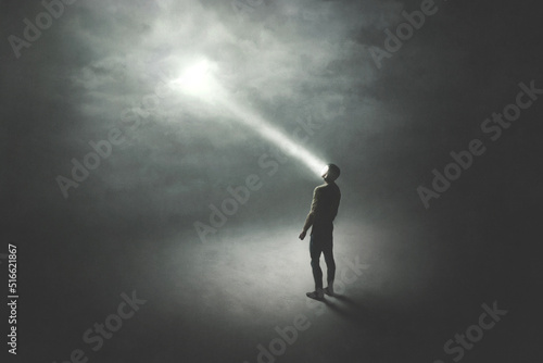 illustration of man illuminated by a beam of light from the sky  surreal abstract concept