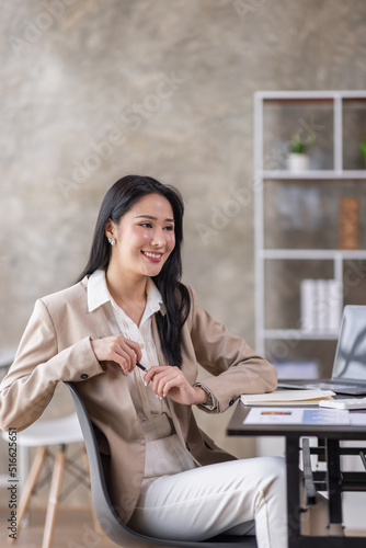 
Portrait of Young woman using laptop computer at the office, Student girl working at home. Work or study from home, Asian woman freelance, business, lifestyle concept