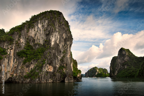 Amazing view of rock pillar island in Halong Bay, Vietnam, Southeast Asia. UNESCO World Heritage Site. Junk boat cruise to Ha Long Bay. Landscape. Popular landmark, famous destination of Vietnam