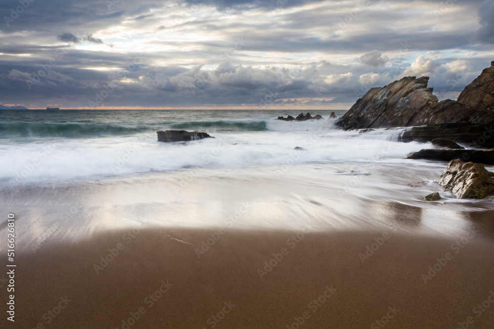 Sunset at Azkorri beach in the coast of Biscay, Basque Country, north of Spain. 