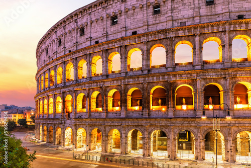 Obraz na płótnie Illuminated Coliseum at sunrise beautiful side view, Rome, Italy w salonie