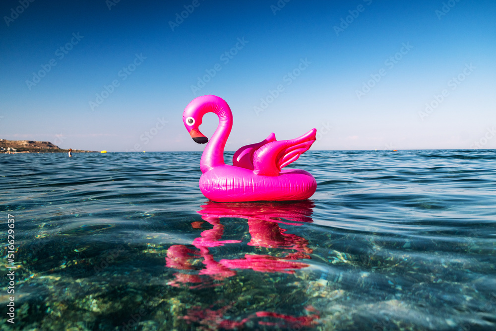 pink flamingo inflatable on the sea pink flamingo inflatable on the sea