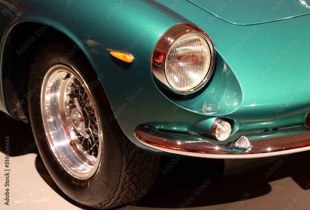 Retro car close up photo. Beautiful details of vintage auto. Headlight beam close up. 