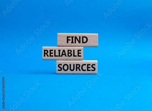 Find reliable sources symbol. Wooden blocks with words Find reliable sources. Beautiful blue background. Business and Find reliable sources concept. Copy space.