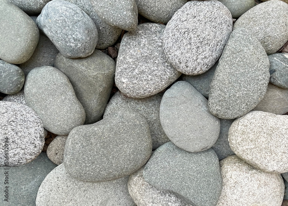 Pebble round stones for meditation on blurred abstract background. Rounded pebble stones for meditation laying on seacoast. Spa stones, zen like concept. Pile of circle stones high quality photo. Pebble round stones for meditation on blurred abstract background. Rounded pebble stones for meditation laying on seacoast. Spa stones, zen like concept. Pile of circle stones high quality photo.