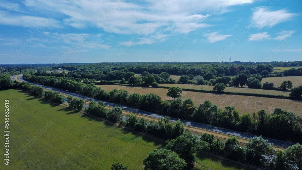 Aerial view of farmers fields and A10 motorway