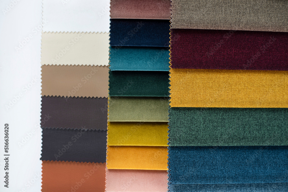 Fototapeta premium Fabrics of different colors are compiled in the form of a catalog for choosing fabric for fabric blinds or upholstered furniture. Close up