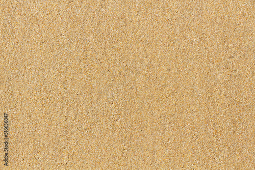 Foto Detail of  texture of wet sand on the beach