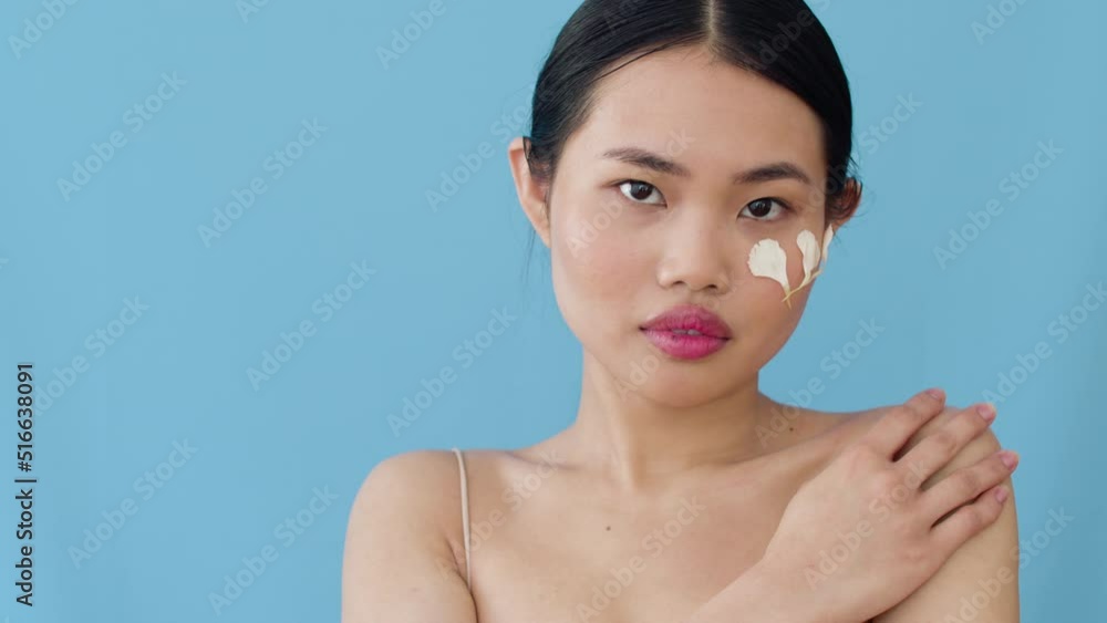Joyful Asian Woman With Flower Petals Make up Posing In Studio. Joyful Asian Woman With Flower Petals Make up Posing In Studio.