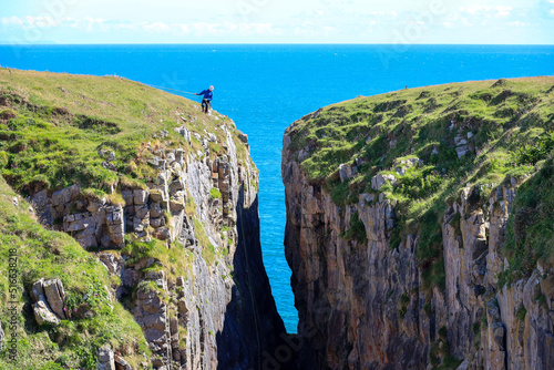 person abseiling on cliffs