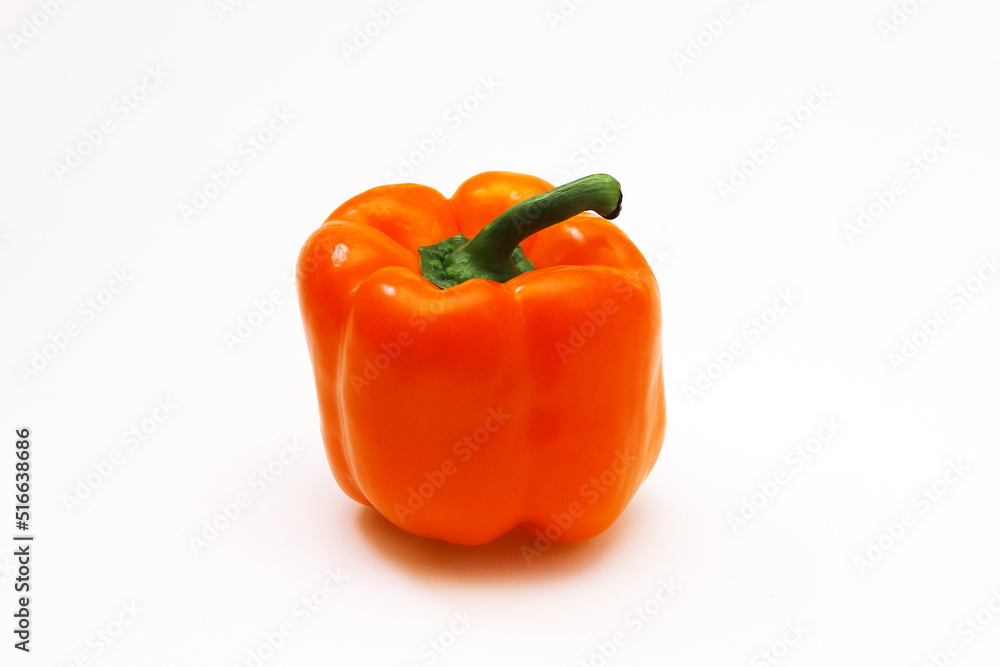 Orange pepper on a white background. Close-up Orange pepper on a white background. Close-up