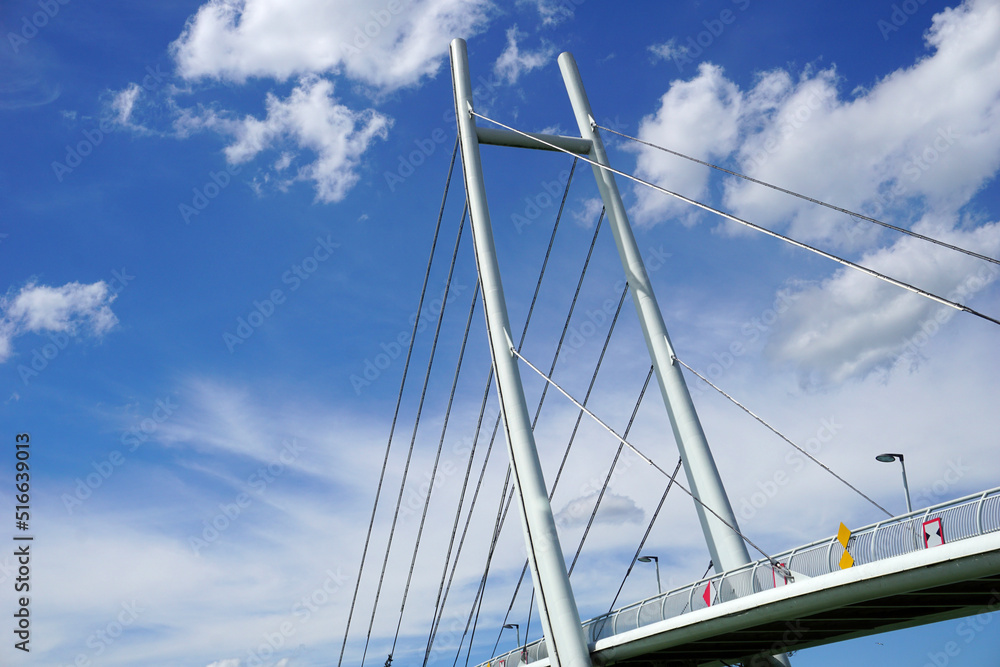 Modern cable-stayed bridge, sky with clouds Modern cable-stayed bridge, sky with clouds