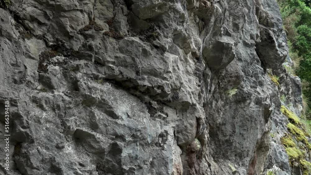 Creepy dark rough rock surface. Wet prehistoric grotto. Stone natural cave wall. Dramatic view Creepy dark rough rock surface. Wet prehistoric grotto. Stone natural cave wall. Dramatic view