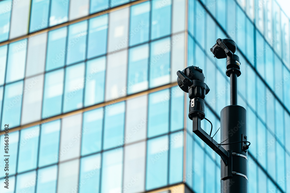 CCTV cameras monitoring a downtown highrise city CCTV cameras monitoring a downtown highrise city