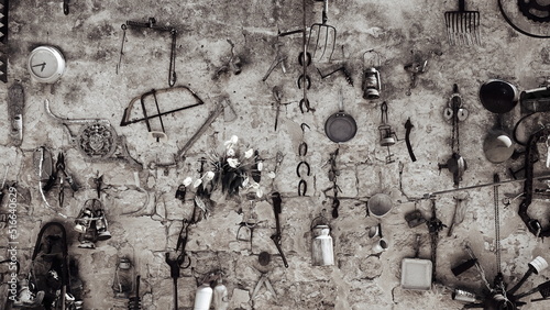 Antiquary Stuff on the Wall. Used Tools. Obsolete Things. Black and White Photo