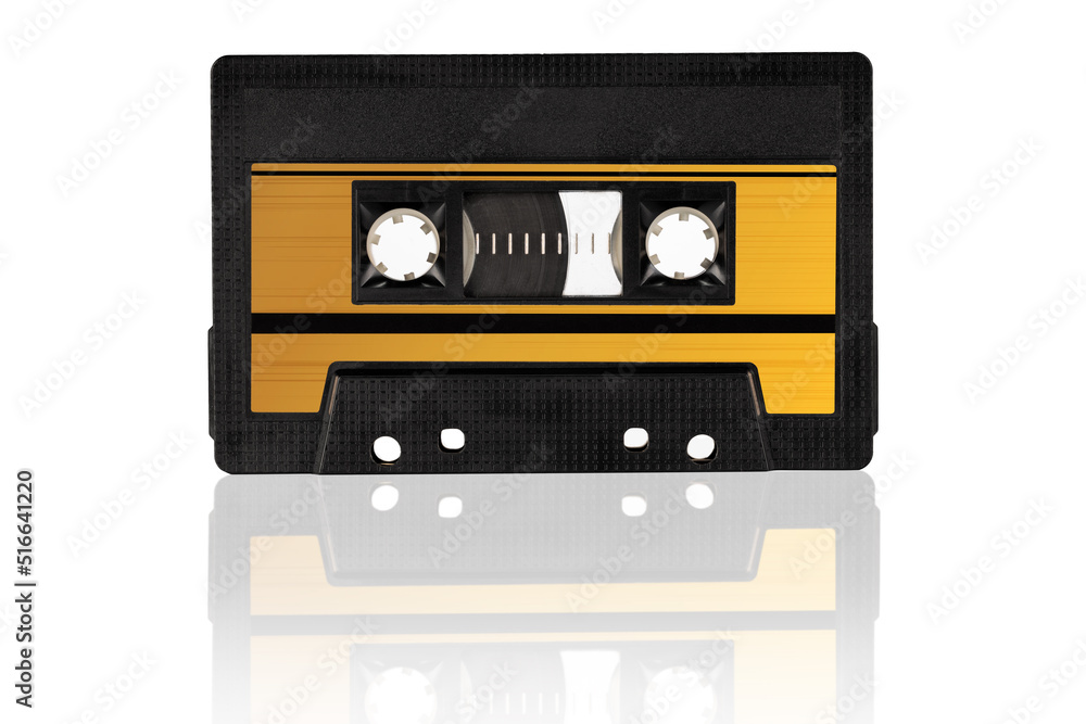Obraz premium Retro gold audio cassette isolated on white background, close-up. Eye level shot.