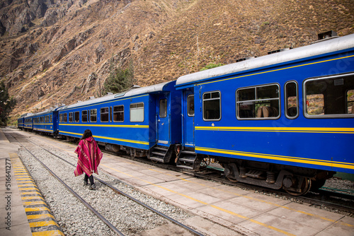 woman by train to get to Aguas Calientes and climb to Machupichu, the Inca ruins in Peru