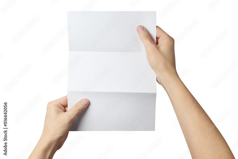 Fototapeta premium Hands holding a folded sheet of white paper, isolated on white background