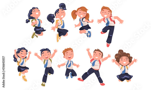 Fotografia Happy Pupils in Uniform with Tie and Backpack Jumping with Joy Excited About Bac