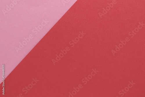 Two color  pink and red  textured paper background. Texture with blank space and copy space
