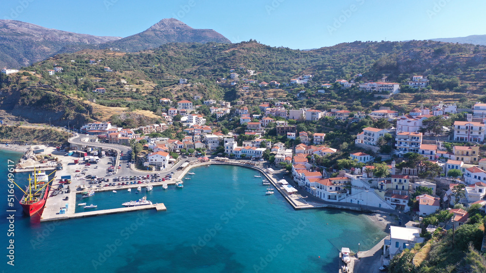 Aerial drone photo of famous small picturesque port of Evdilos in island of Ikaria, Northeast aegean, Greece