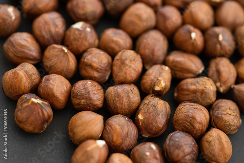 Hazelnuts on dark rustic wooden background